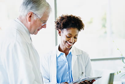 Two doctors looking over patient file